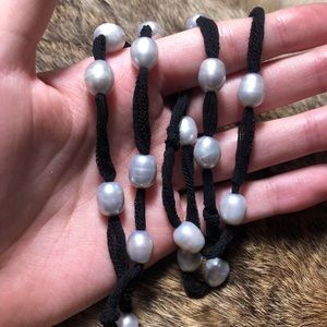 Handmade genuine gray pearl necklace strung on a black lacy fabric